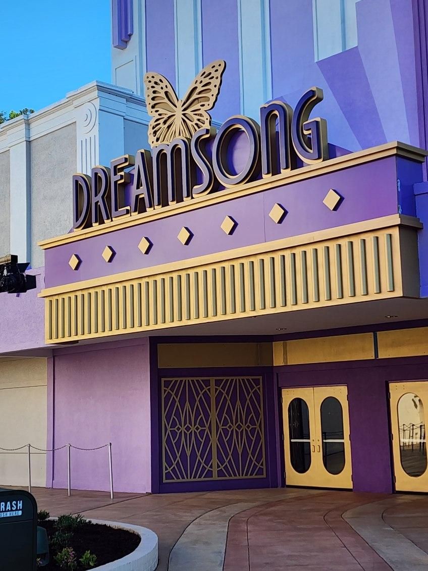 A purple building with the word dreamsong on it