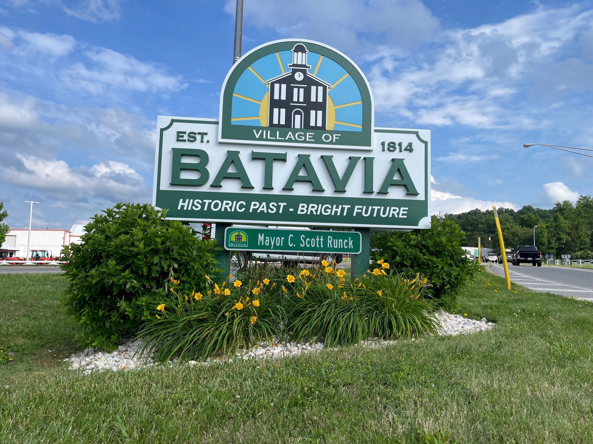 A green and white sign that says batavia on it