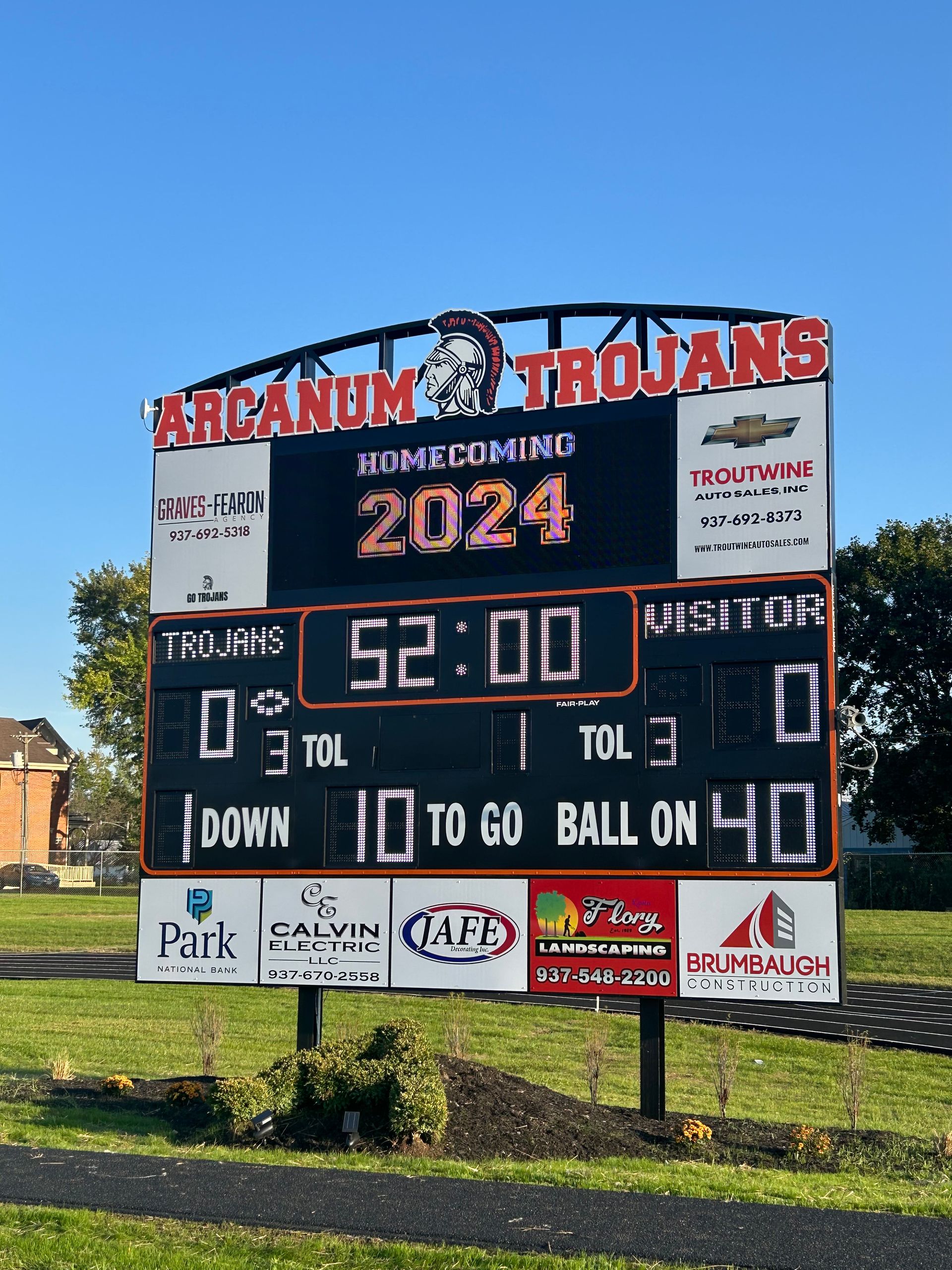 A scoreboard for the arcanum trojans football team