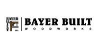 Bayer Built Woodworks logo with black text and small building icon on white background