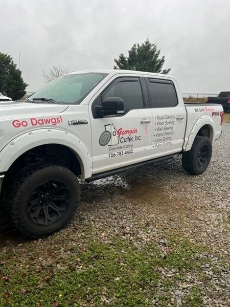 White pickup truck with black wheels,