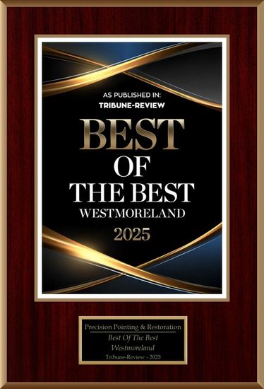 Award plaque: Best of the Best Westmoreland 2025, black background with gold and blue accents, set on a wood plaque.