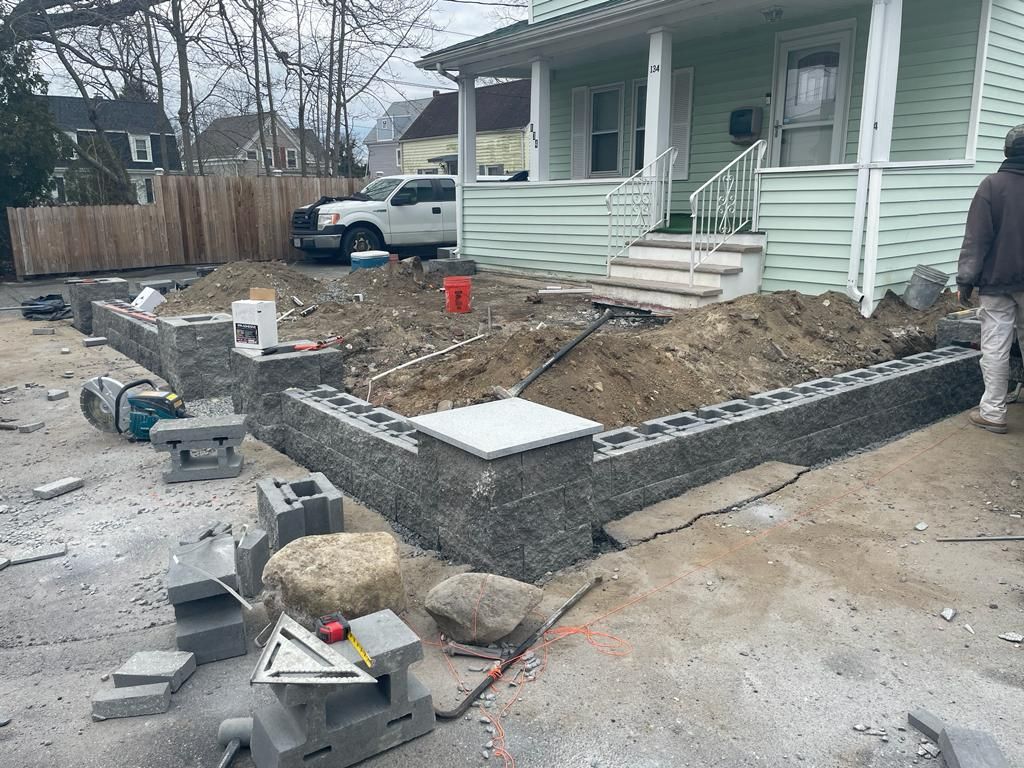 a man is standing in front of a house that is being built.