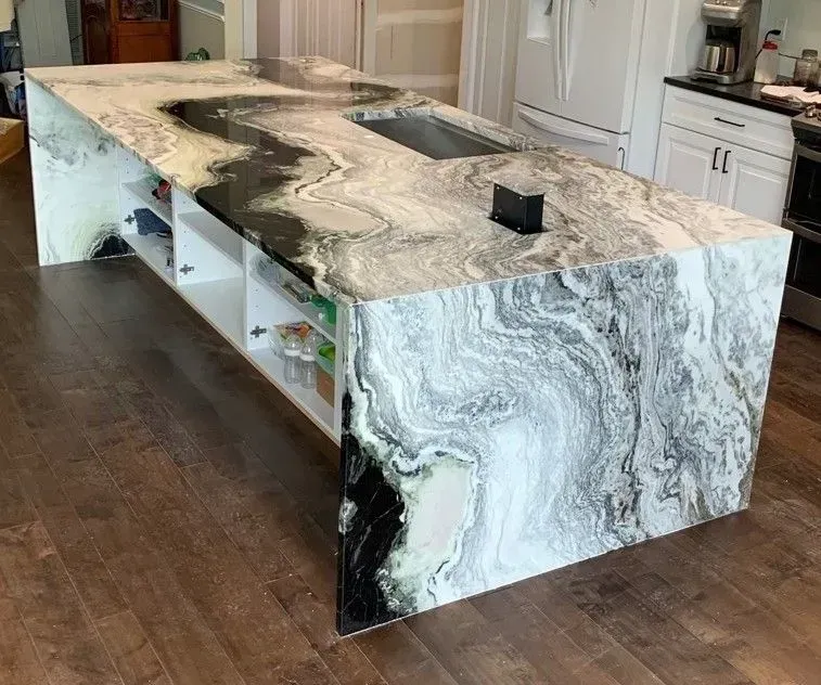 Large white-and-gray marble kitchen island with built-in sinks in a modern kitchen