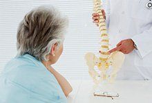 Doctor explaining the spine to a patient