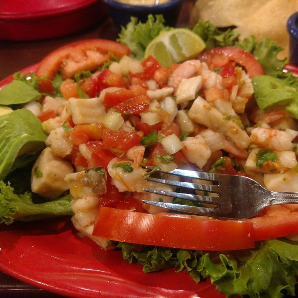 A close up of a plate of food with a fork in it