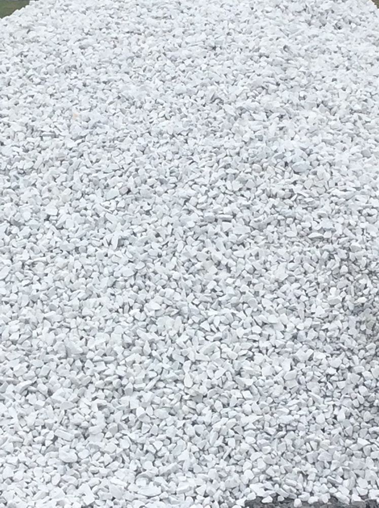 A pile of white gravel is sitting on the ground.
