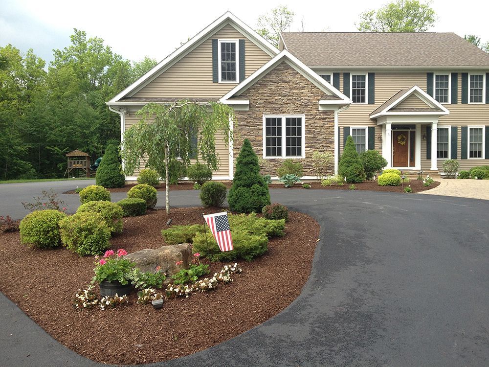 A large house with a flag in front of it