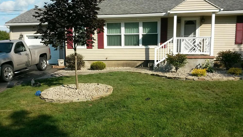 A house with a truck parked in front of it