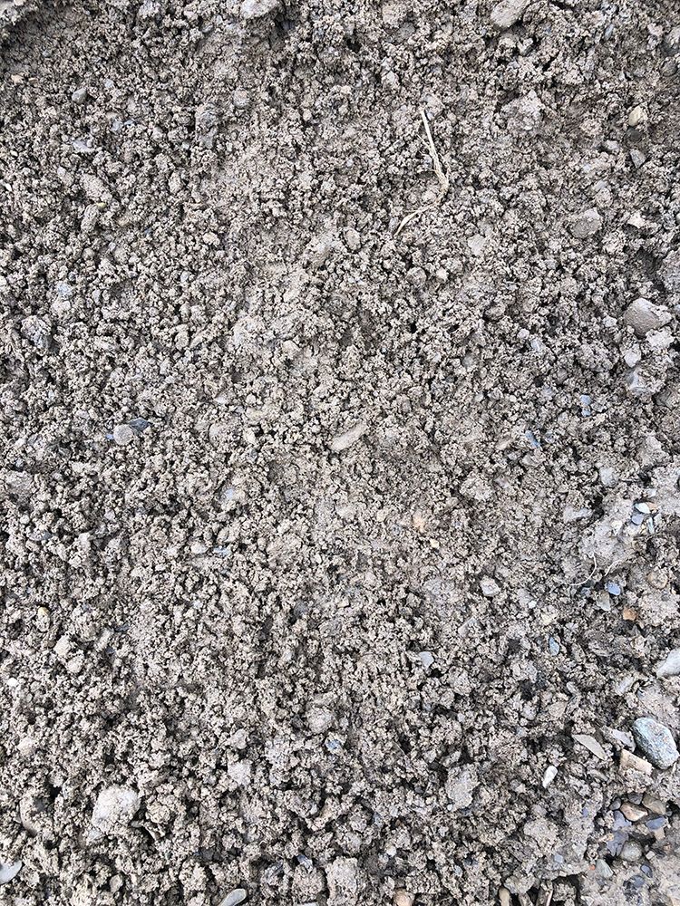 A pile of gravel is sitting on the ground.
