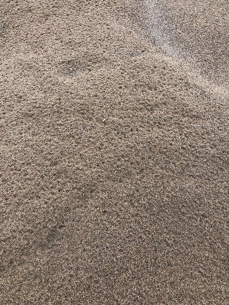 A close up of a pile of gravel on the ground.