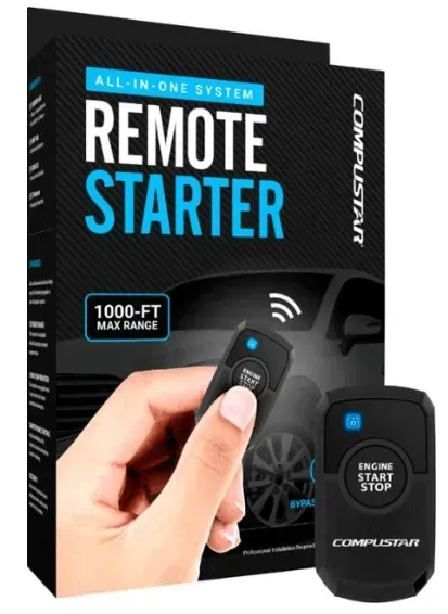 A person is holding a remote starter in front of a box.