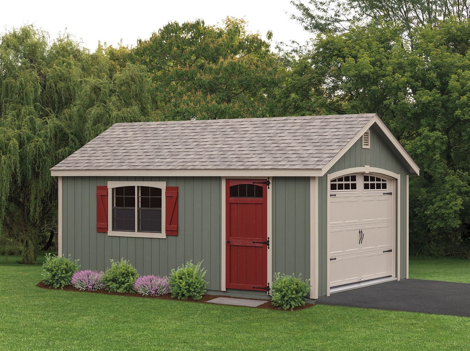 Small gray garden shed with red door and shutters, white garage-style side door, and flowers by a lawn
