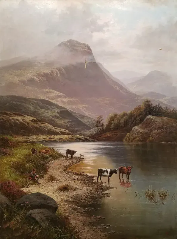 Cows drinking by a calm lake beside a mountain under a soft, misty sky