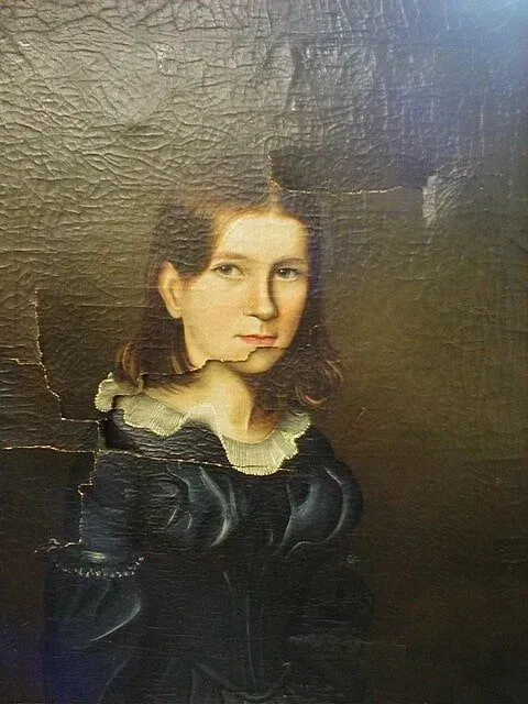 An oil painting of a person wearing a dark, high-collared dress, featuring significant surface cracks and damage.