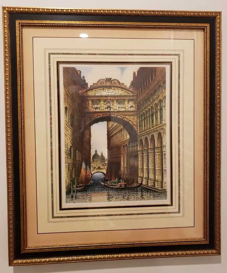 Framed watercolor print of Venice’s Bridge of Sighs spanning a canal with gondolas and architectural details.