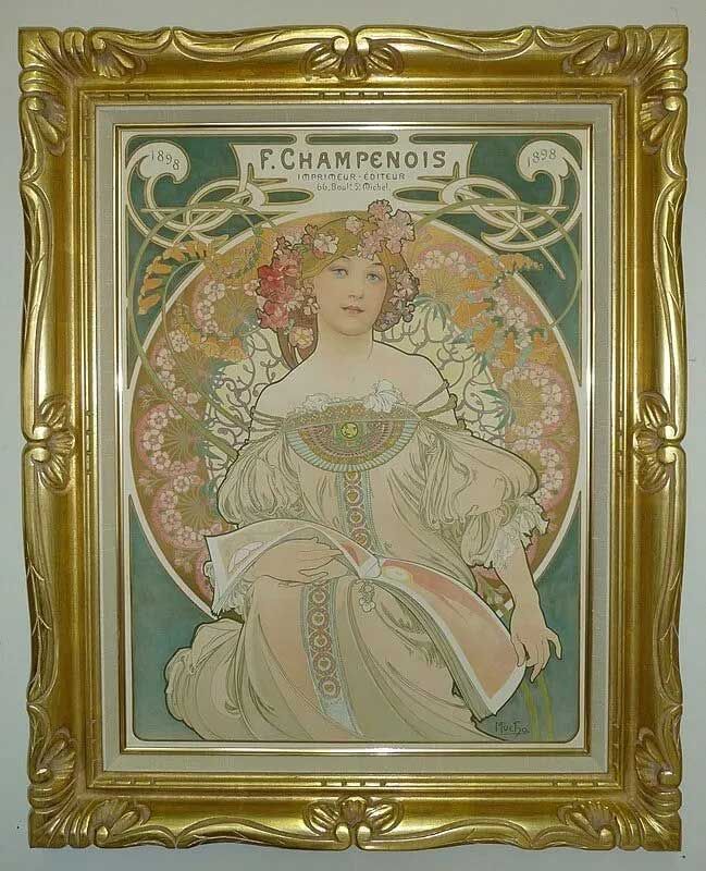 An Art Nouveau poster by Alphonse Mucha for F. Champenois featuring a serene woman, framed in an ornate gold frame.