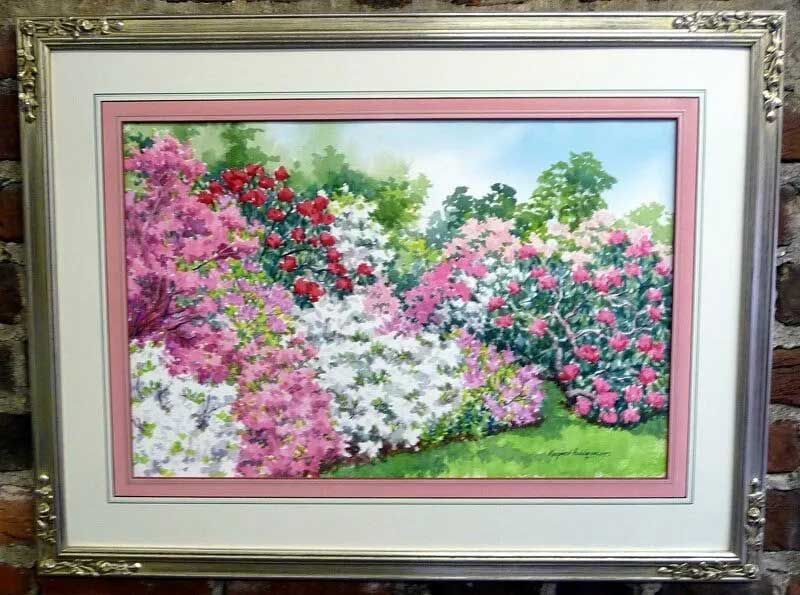 A framed watercolor painting of a lush garden filled with blooming pink, red, and white azalea bushes on a grassy lawn.