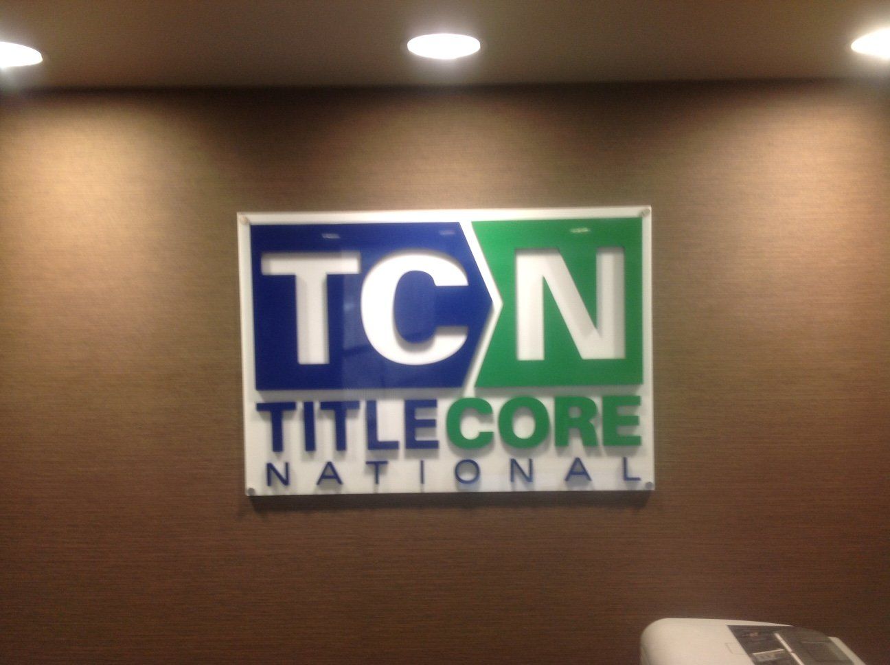 A sign that says tcn titlecore national on it