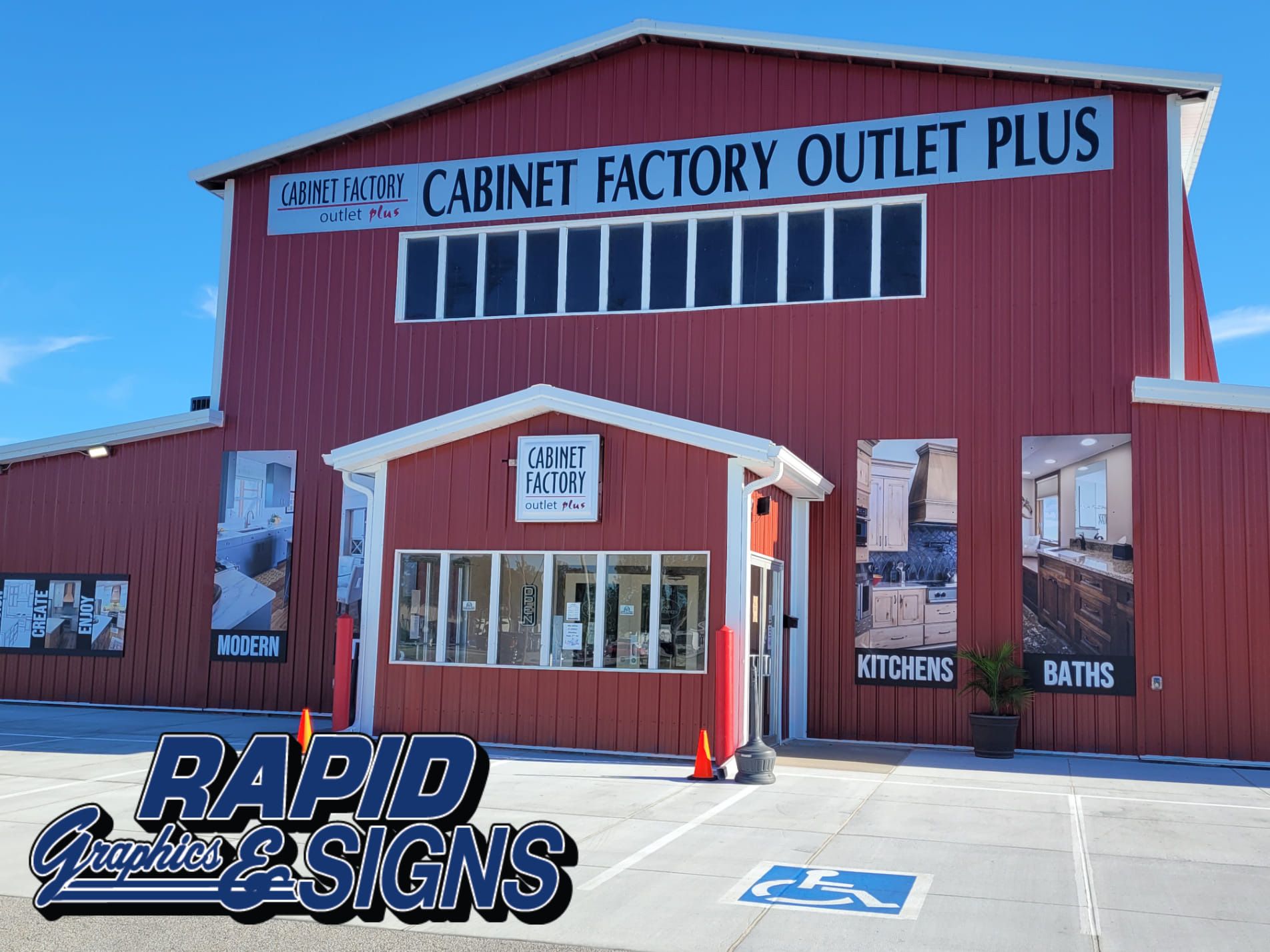 A red building with the words cabinet factory outlet plus on it