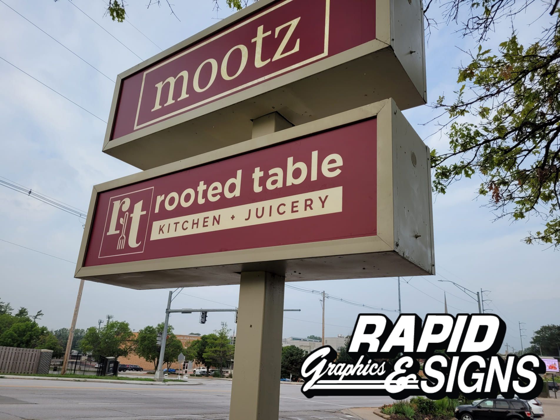 A sign for mootz rooted table kitchen and juicery