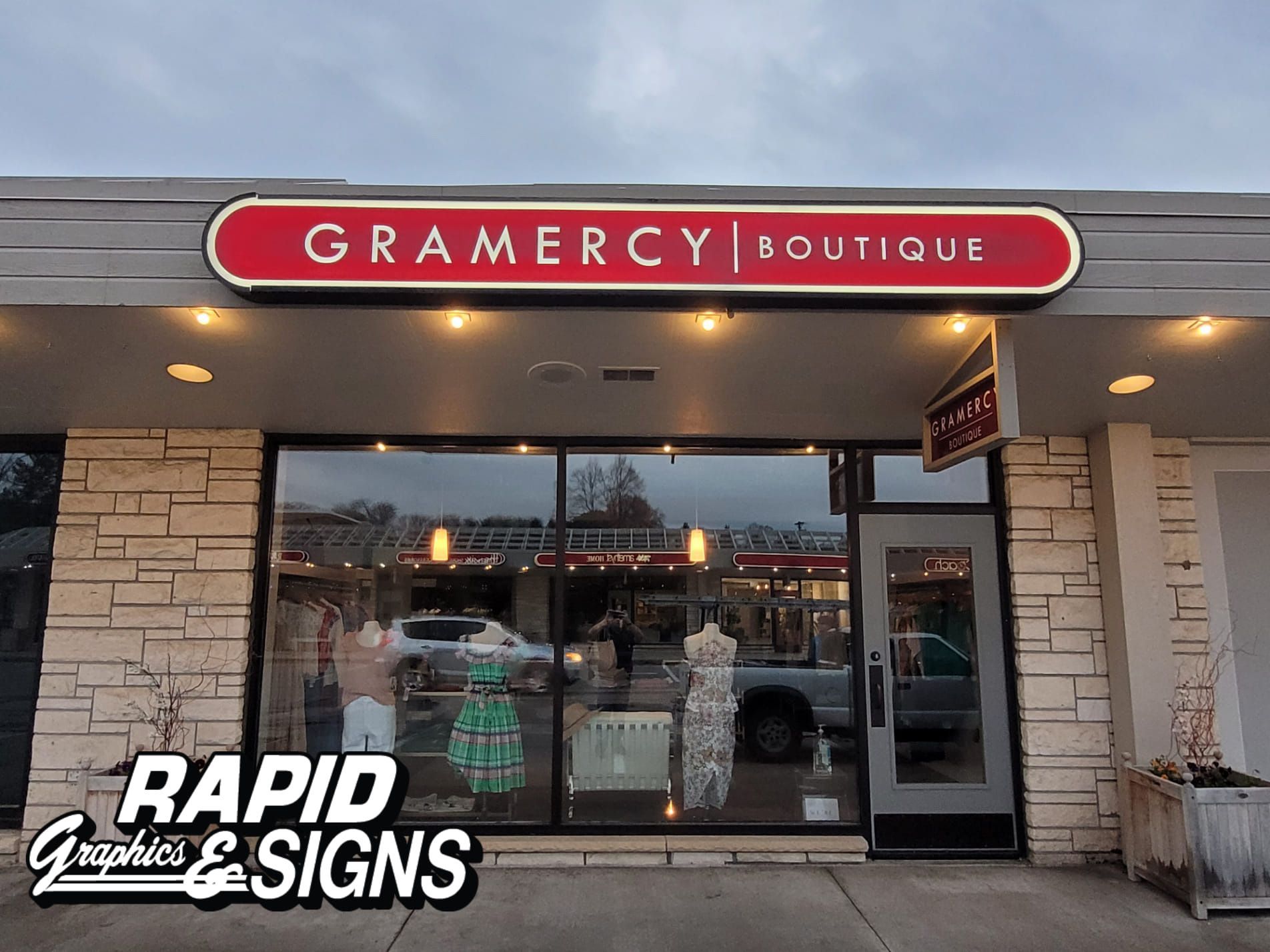 Gramercy boutique has a red sign above the door