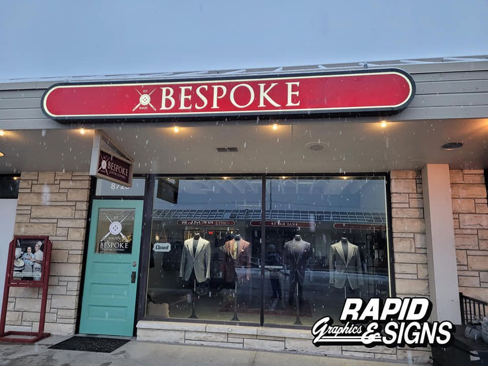 A store front with a red sign that says bespoke