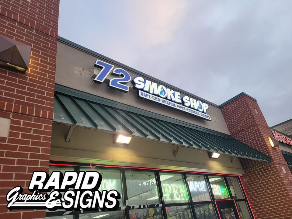 A brick building with a sign that says 72 smoke shop on it.