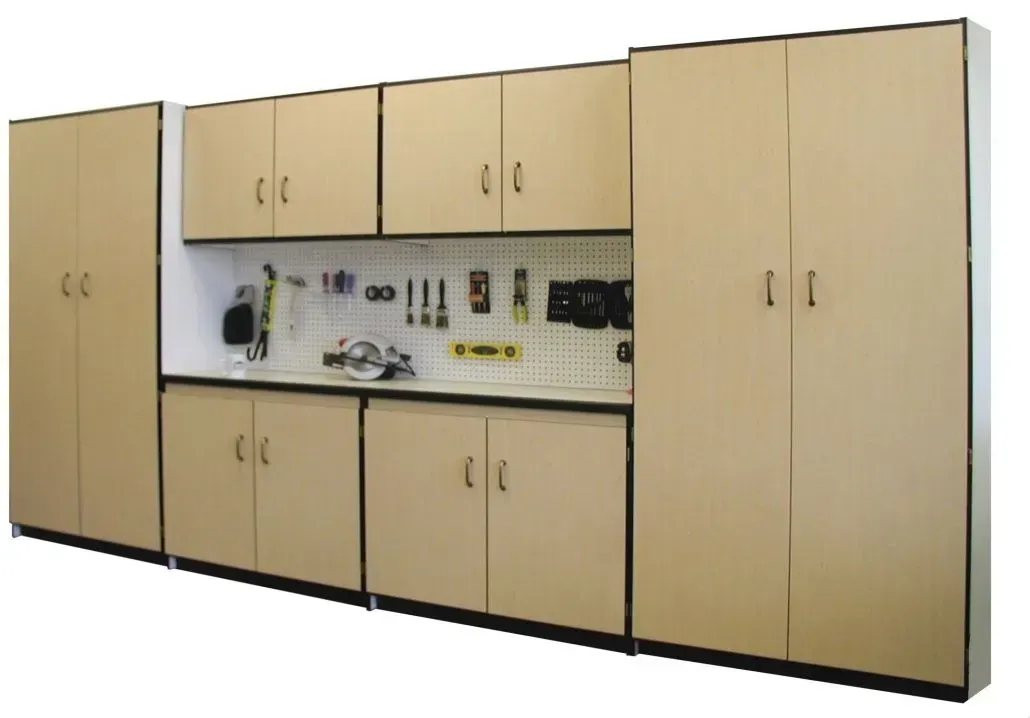 Tan garage storage cabinets with a pegboard and tools.
