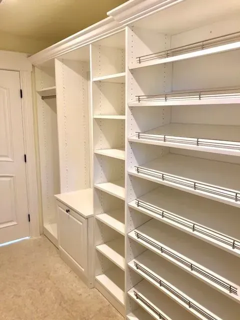 White custom closet with shelves and drawers.
