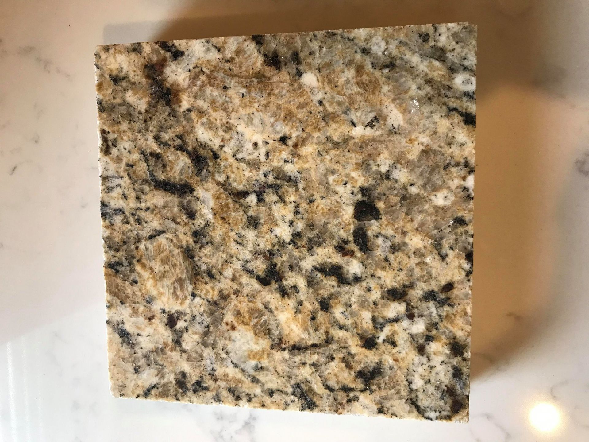 A close up of a piece of granite on a counter top