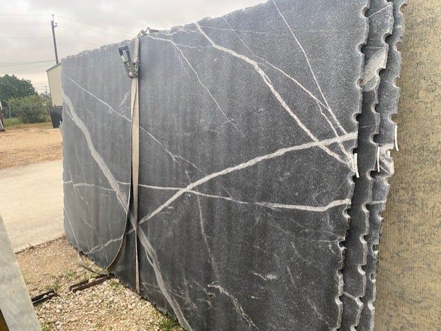A stack of marble slabs sitting on top of each other.