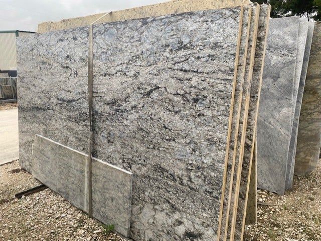 A stack of granite slabs sitting on top of each other.
