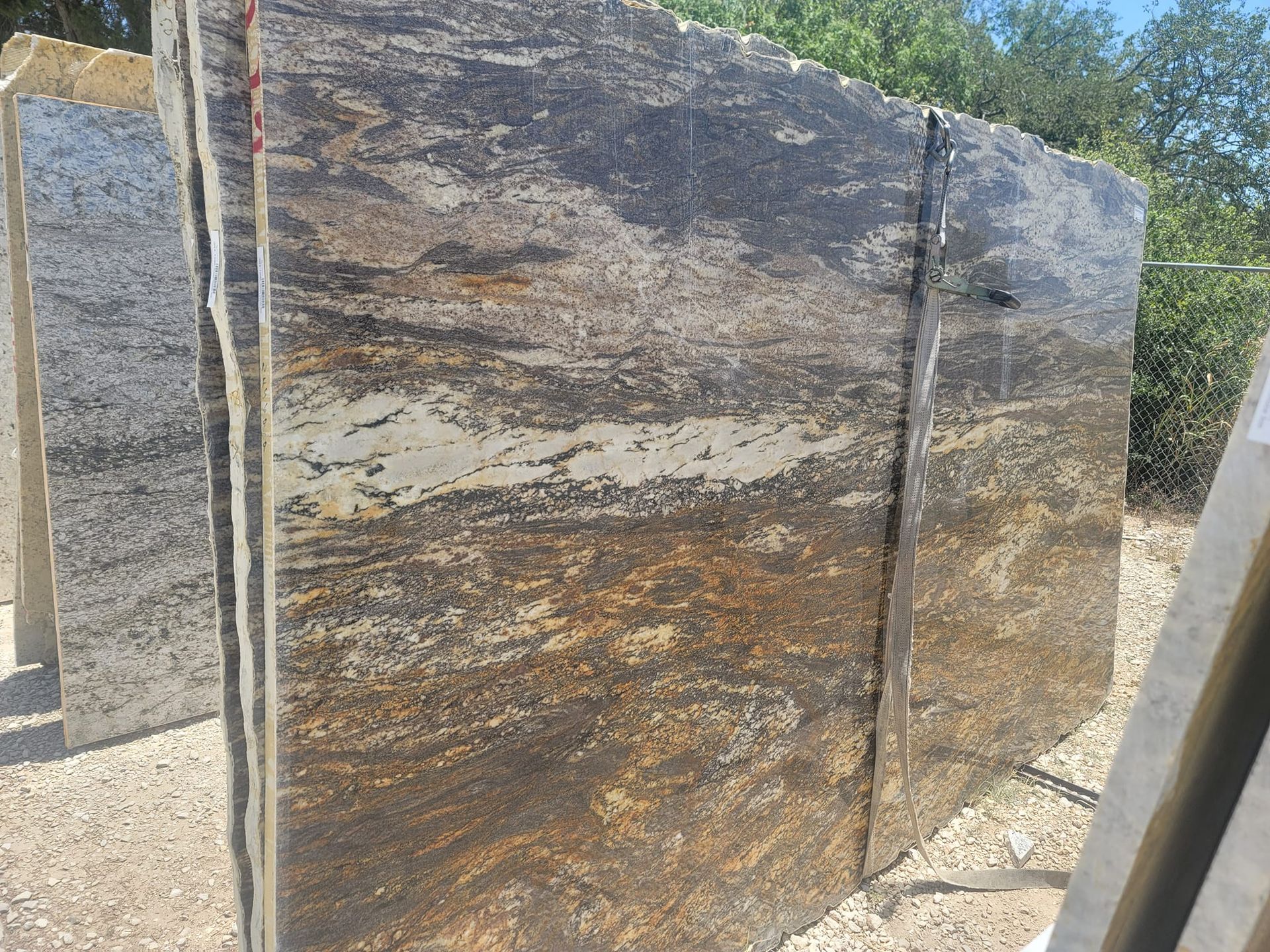 A large piece of rock is sitting on top of a pile of rocks.