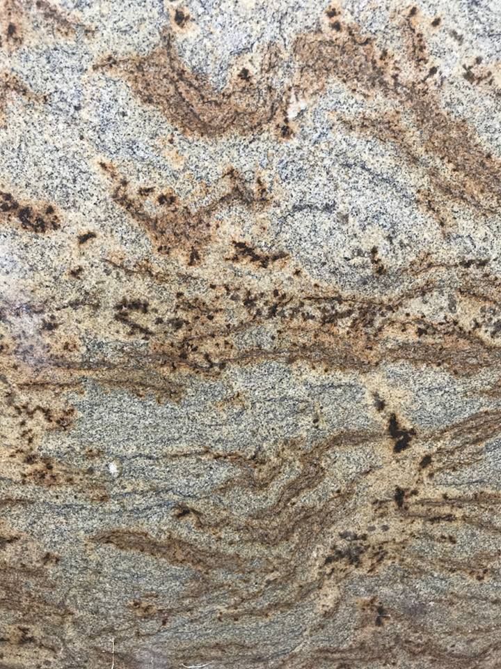 A close up of a granite counter top with a marble texture.