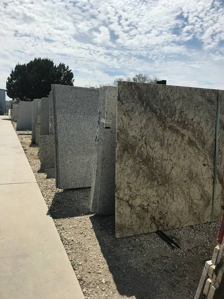 A row of granite slabs sitting next to each other on a sidewalk.
