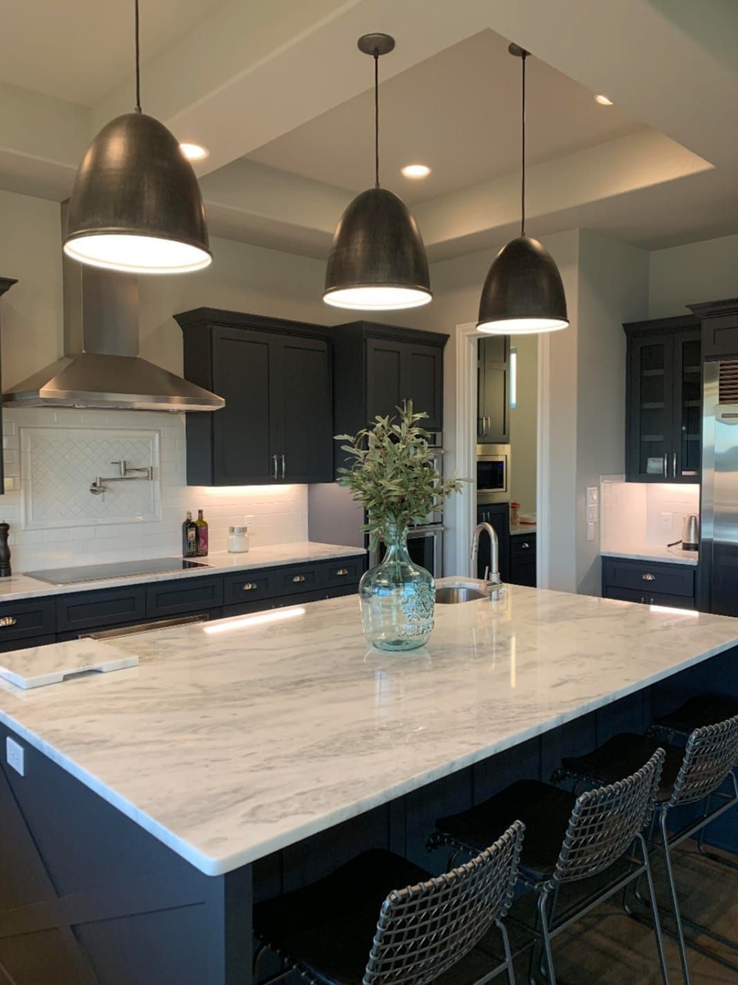 There is a large island in the middle of the kitchen.