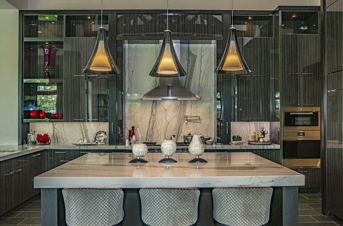 There is a large island in the middle of the kitchen.