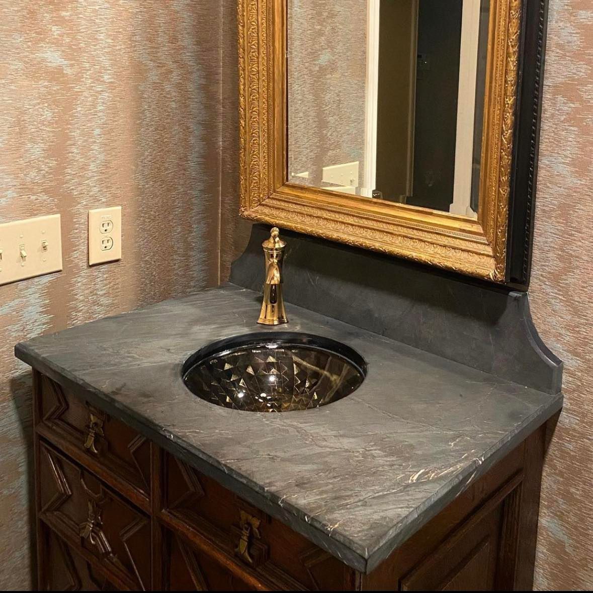 A bathroom sink with a mirror above it