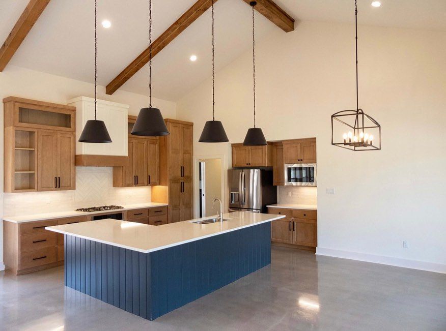 A kitchen with a large island in the middle of it