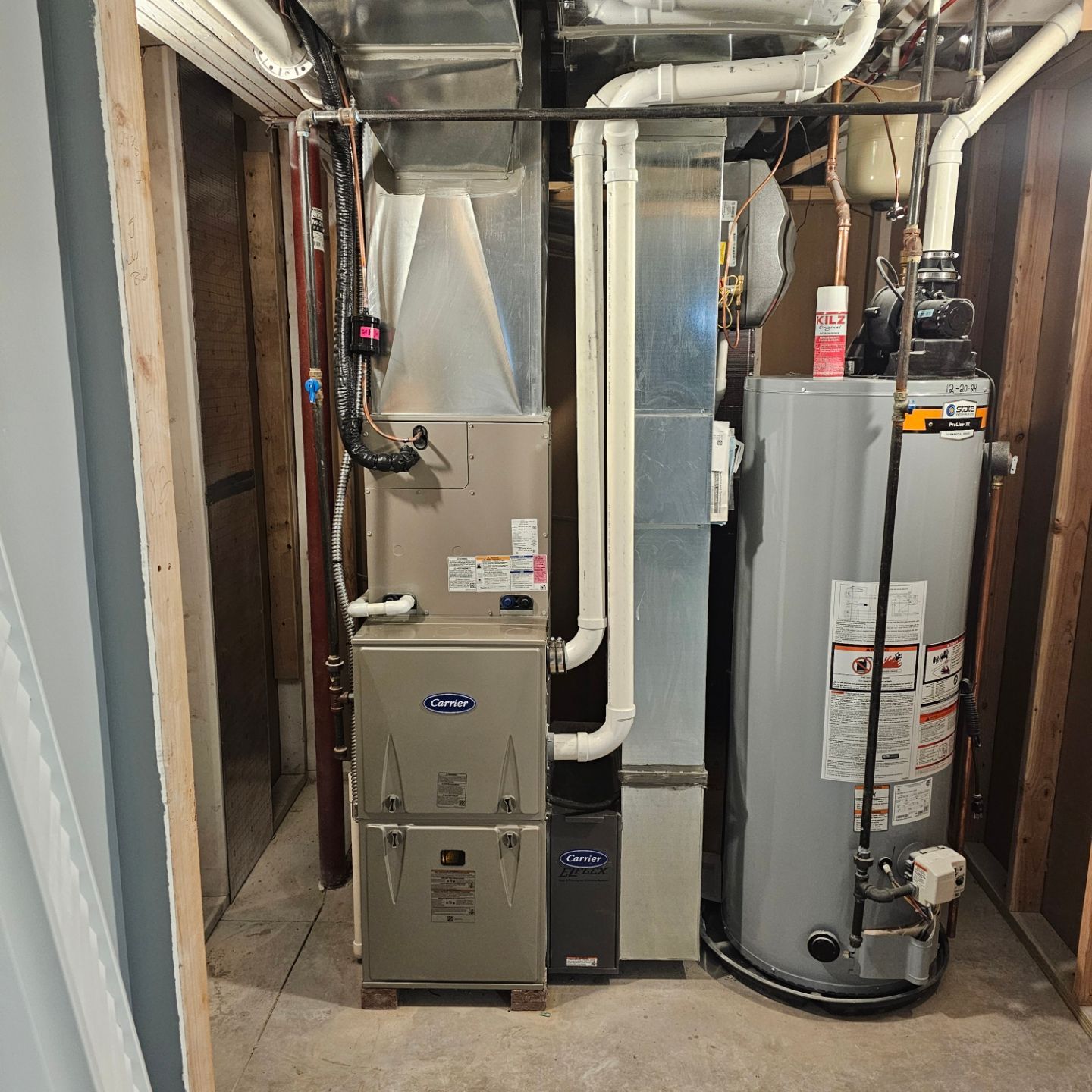 A room with a furnace and a water heater in it