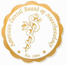 American Dental Board of Anesthesiology seal. Gold emblem with caduceus, leaves, and text, “Est. 1994”.
