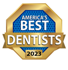 America's Best Dentists 2023 award logo: gold and blue octagon with text 