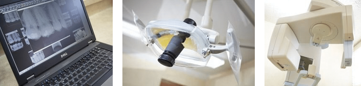 Dental office equipment: laptop displaying an X-ray, overhead light, and a medical device.