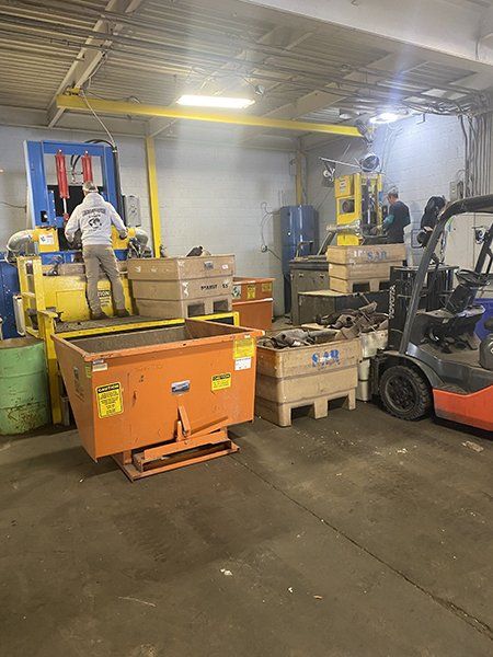 A warehouse filled with lots of boxes and a forklift.