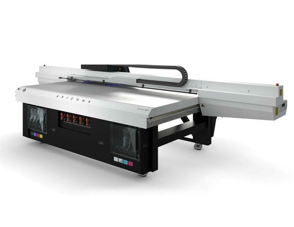 Large flatbed Arizona UV printer on a white surface.