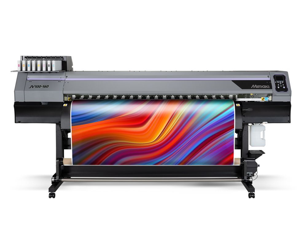 Large format printer printing a vibrant, abstract multicolored design on paper.
