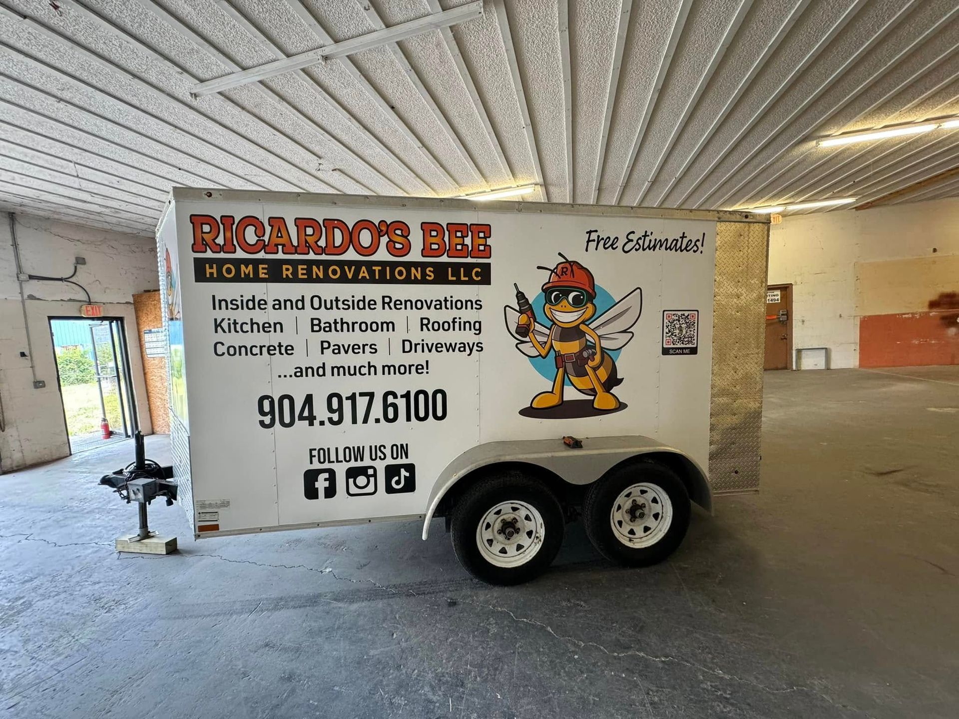 A white trailer with the business name 