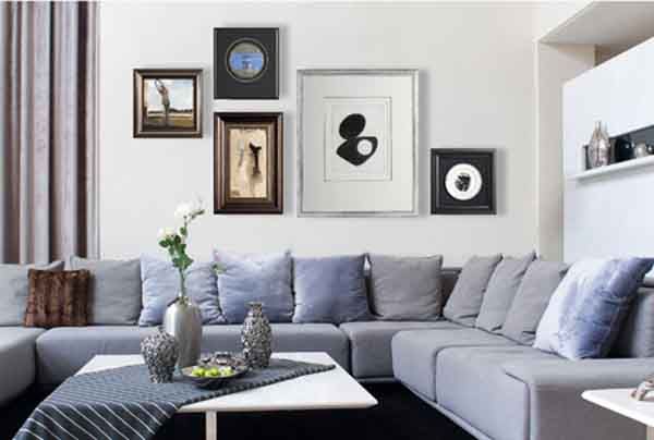 A living room with a large sectional couch and a coffee table