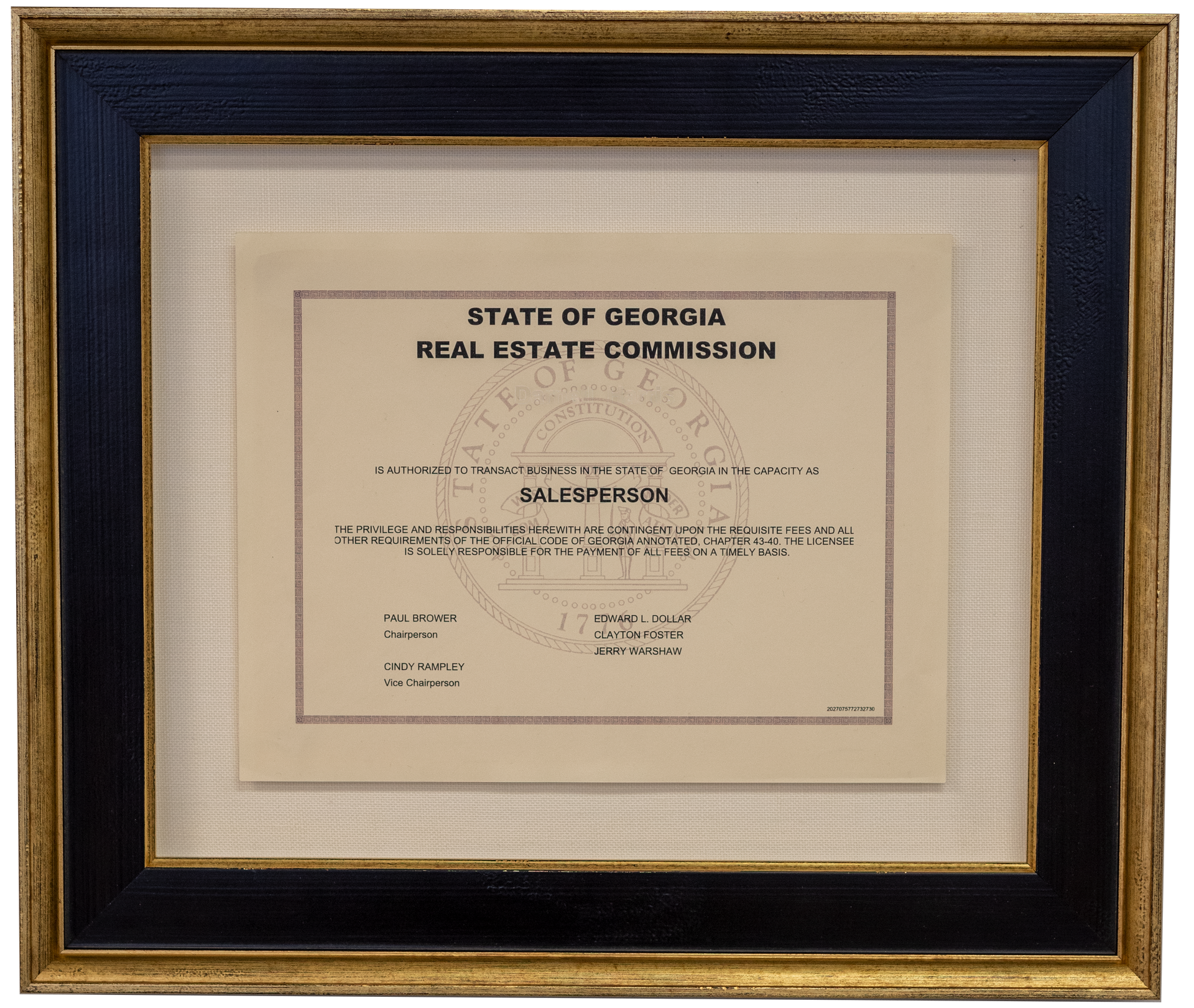 A framed certificate from the Georgia Real Estate Commission, labeled